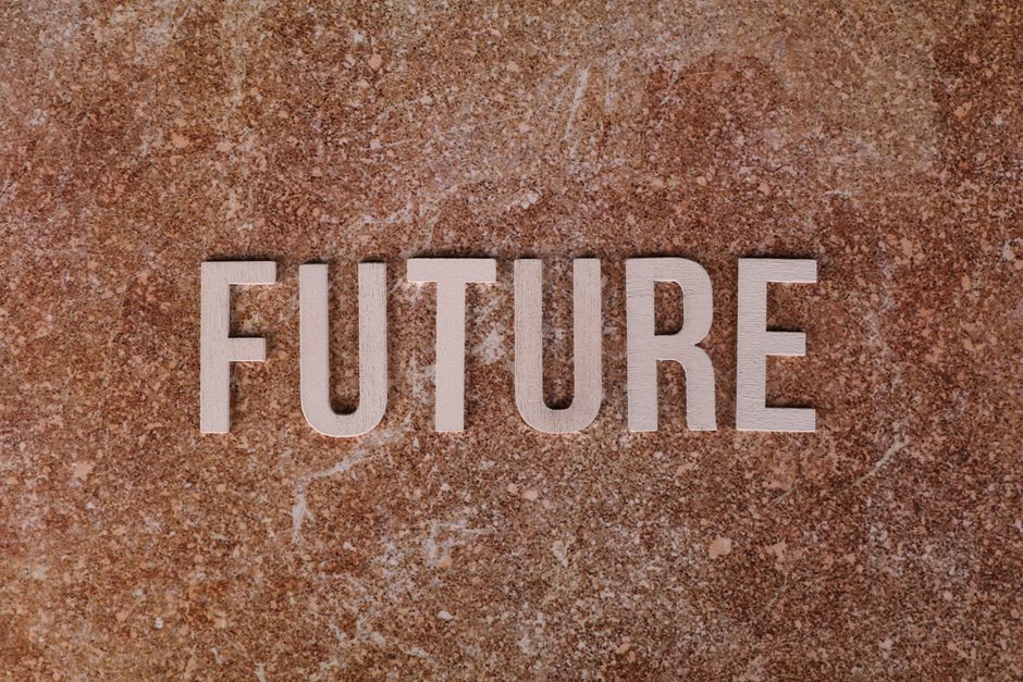The word 'FUTURE' displayed against a textured brown surface.