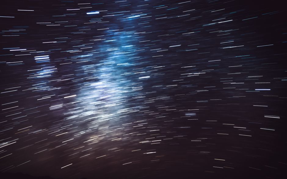 A breathtaking long exposure photograph capturing the movement of stars across the New Zealand night sky.