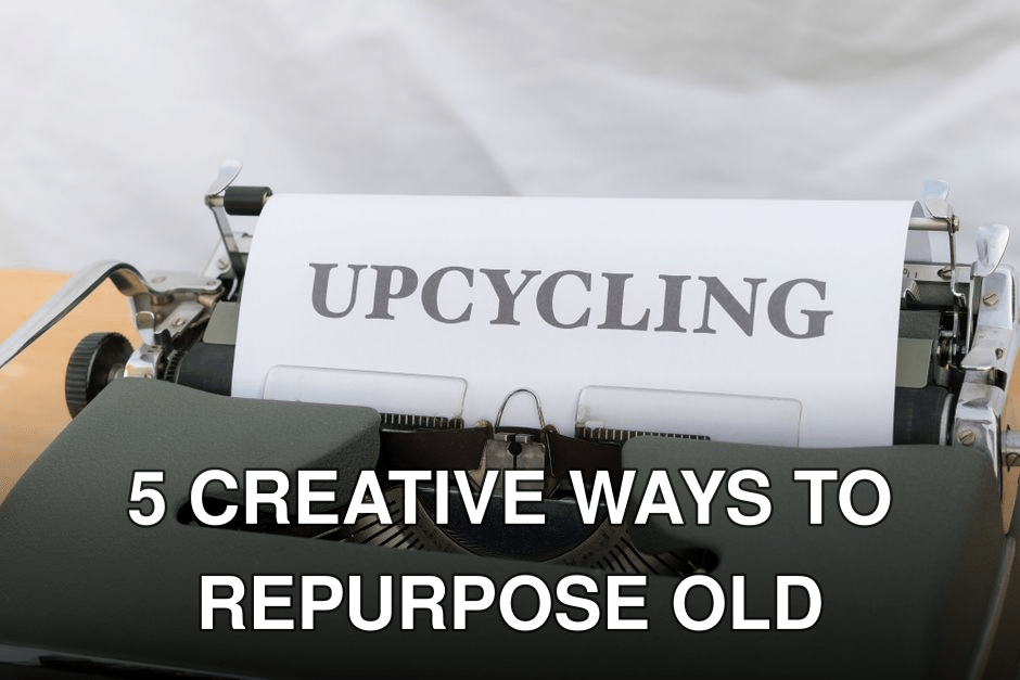 A close-up of a vintage typewriter displaying the word 'UPCYCLING' on its paper.