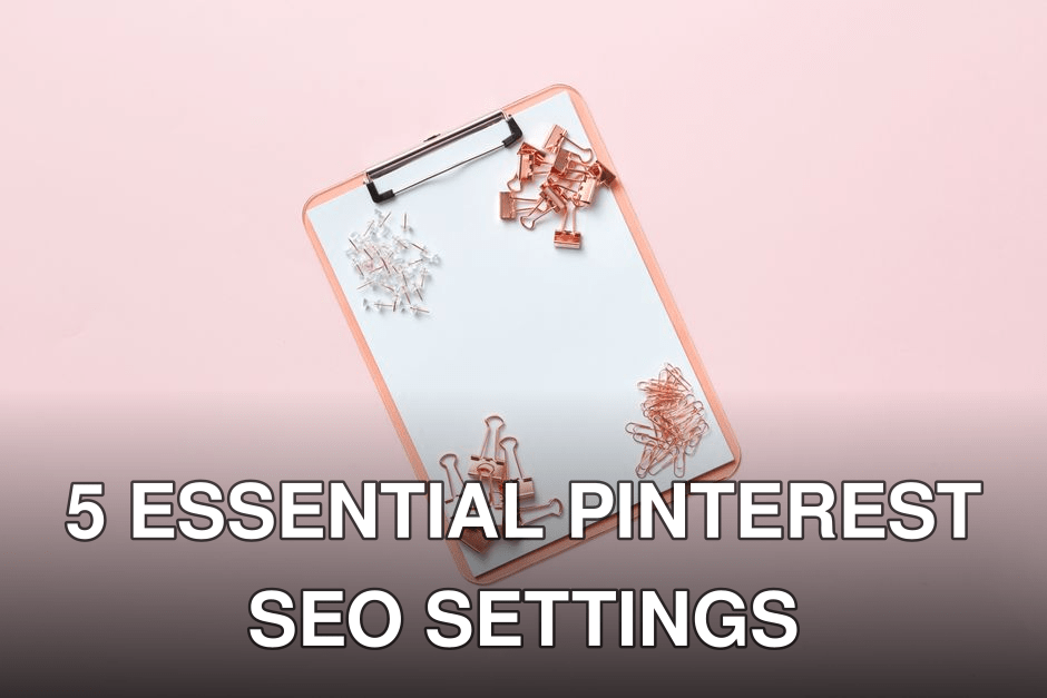 Flat lay image of a pink clipboard with binder clips and paperclips on a pastel pink background.