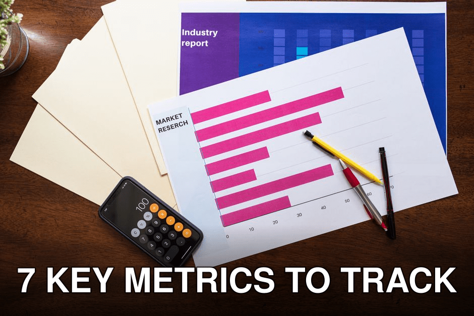 Top view of market research reports and calculator on a wooden desk, illustrating business analysis.