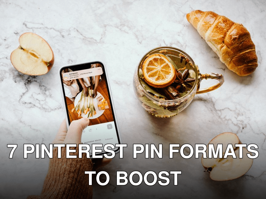 Flat lay of herbal tea with lemon, apple slices, and croissant on marble. Hand holding smartphone.