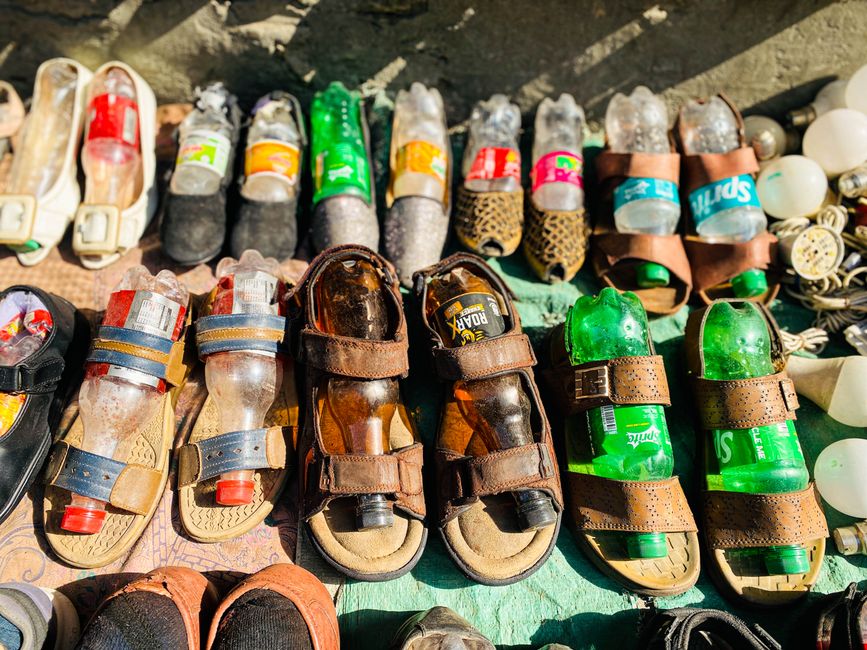 Sustainable footwear crafted from recycled materials in a vibrant Pakistan market.