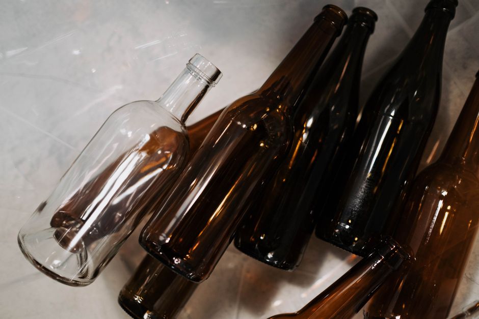 Close-up of brown glass bottles showcasing recycling and waste segregation concepts.