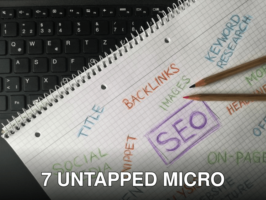 Close-up of notebook with SEO terms and keywords, highlighting digital marketing strategy.