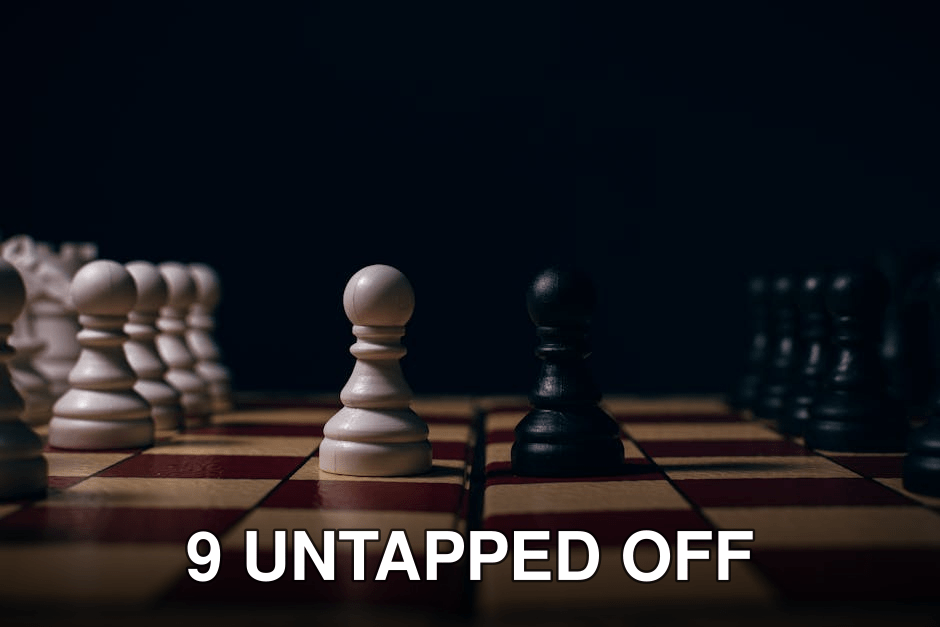 Close-up of chess pawns on a board in a strategic setup, capturing the essence of competition.