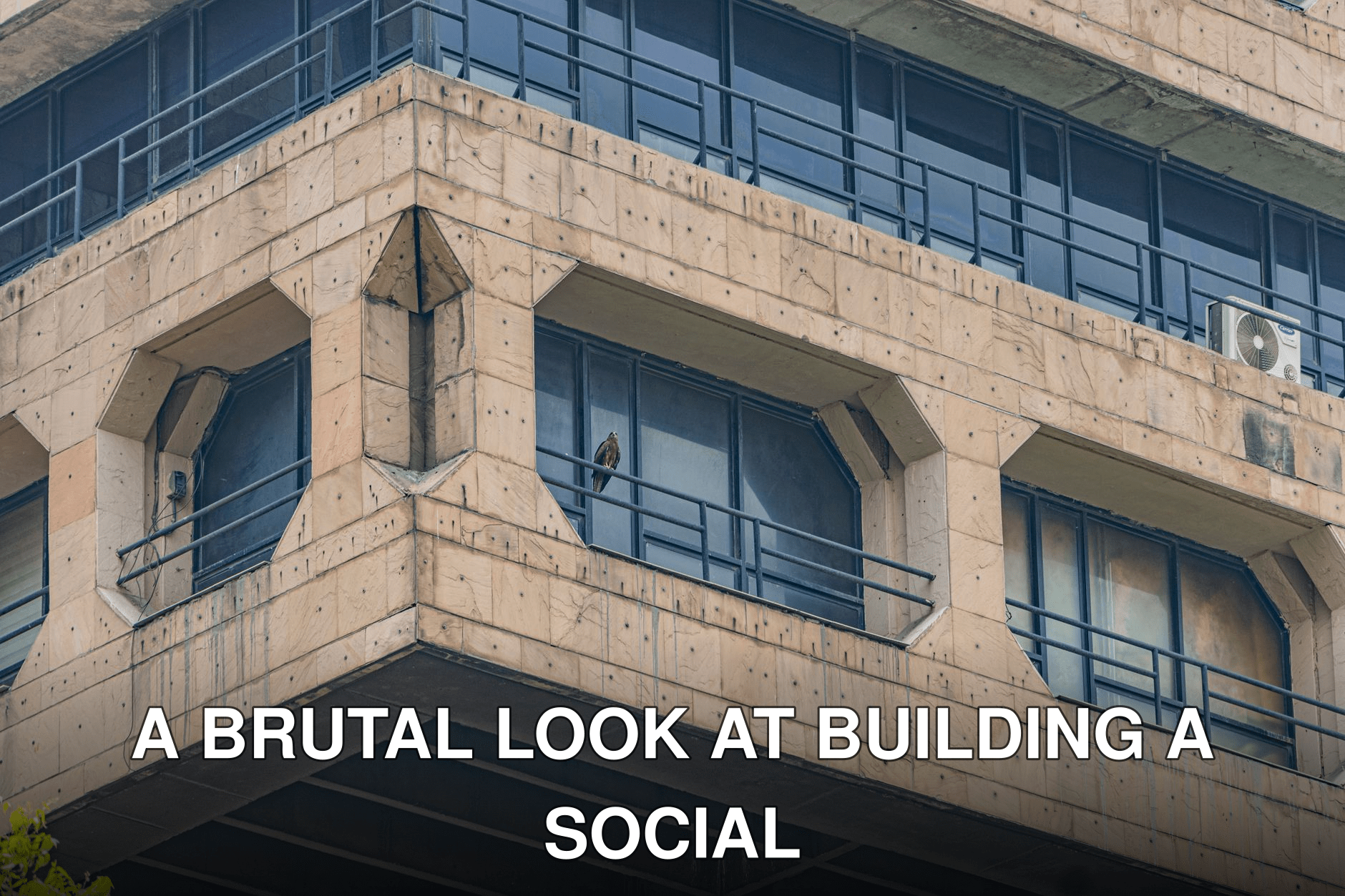 Close-up of a Brutalist building facade in New Delhi, showcasing architectural symmetry.