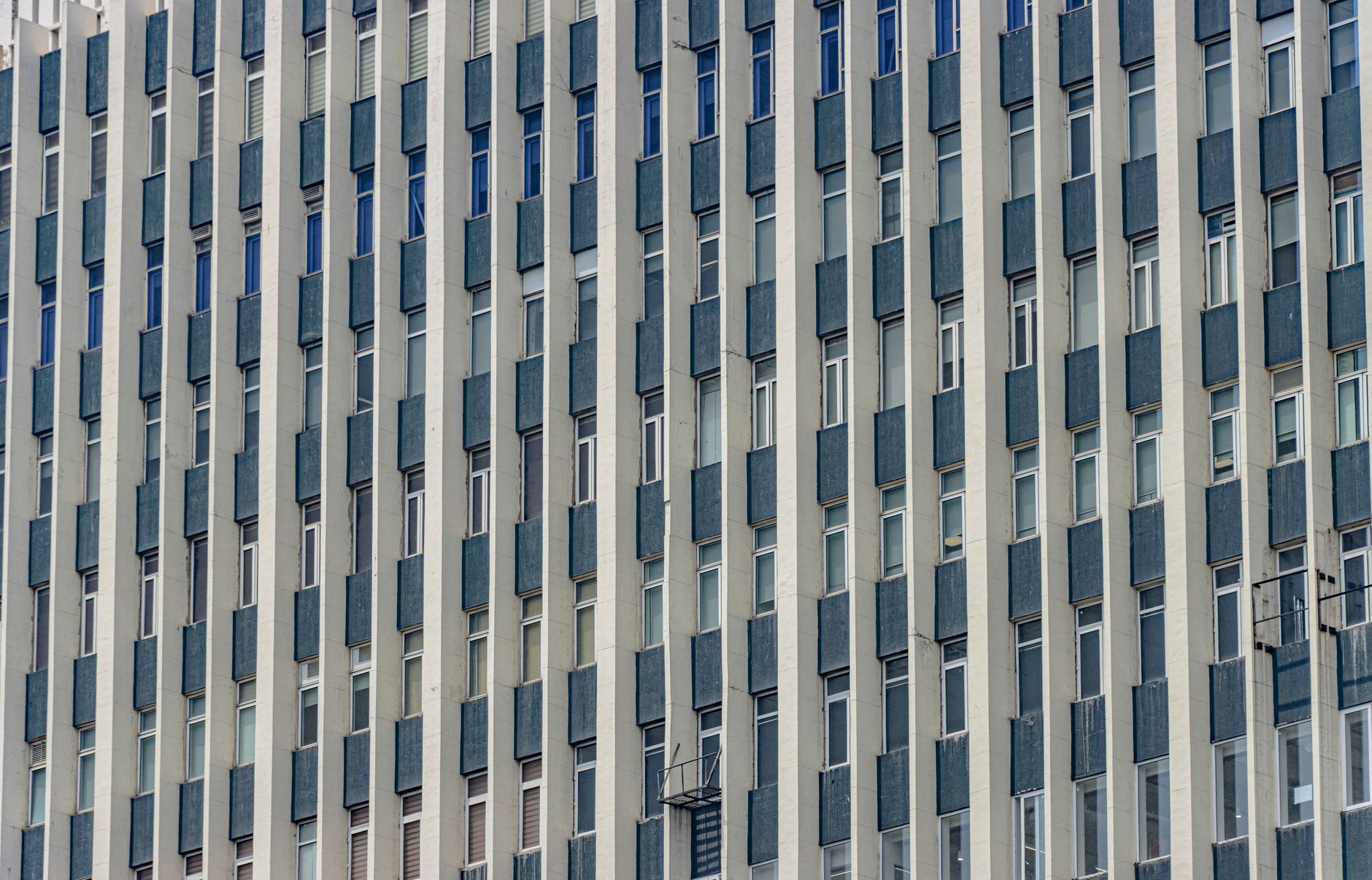 Close-up of a modern building facade with vertical symmetry in New Delhi, showcasing architectural aesthetics.