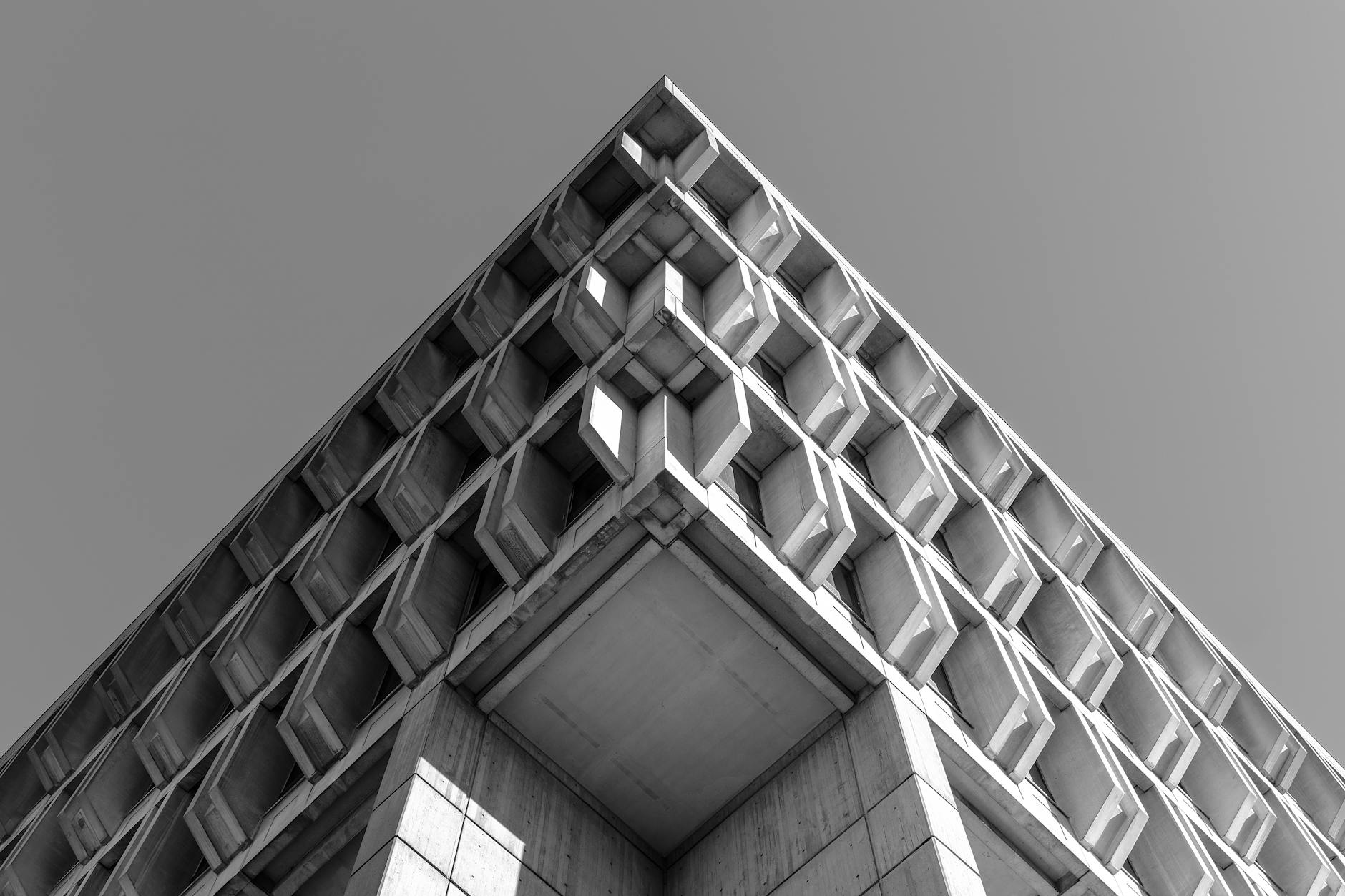 Minimalist black and white low angle view of Brutalist architecture in Boston.