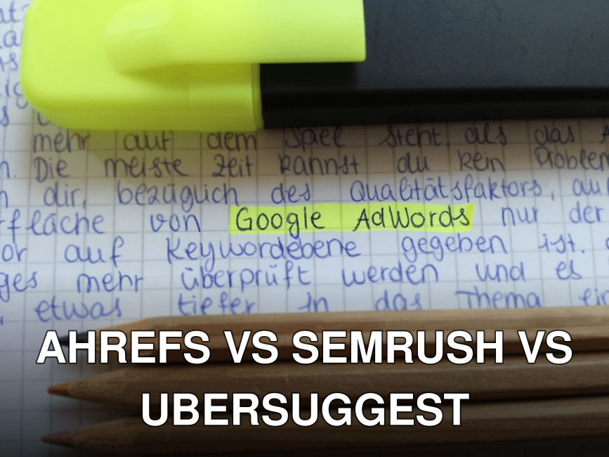 Close-up of colorful pencils on handwritten notes with Google AdWords highlighted.