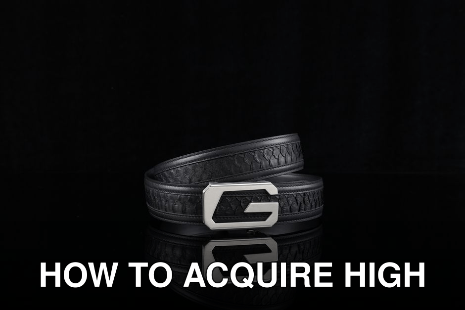 A stylish black leather belt with a distinctive silver buckle on a reflective black surface.