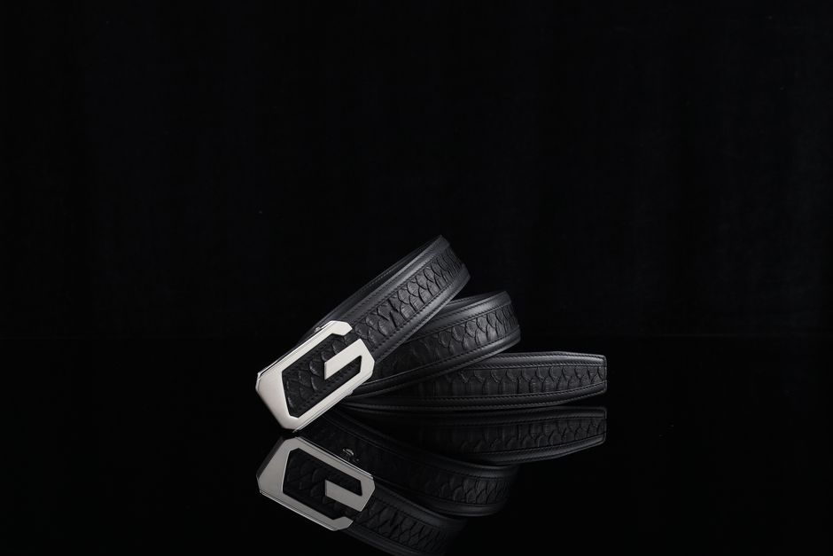 Sleek black leather belt with a modern buckle, perfect for fashion-forward ensembles.
