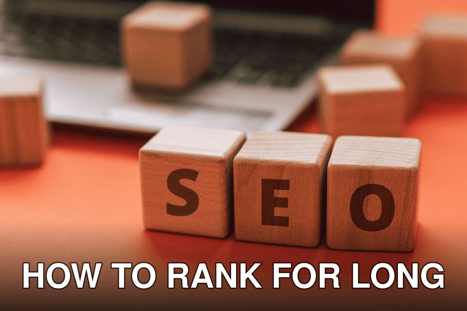 Wooden blocks spelling SEO on a laptop keyboard convey digital marketing concepts.