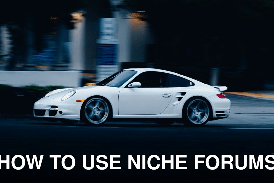A dynamic shot of a white sports car speeding through an urban street at night.