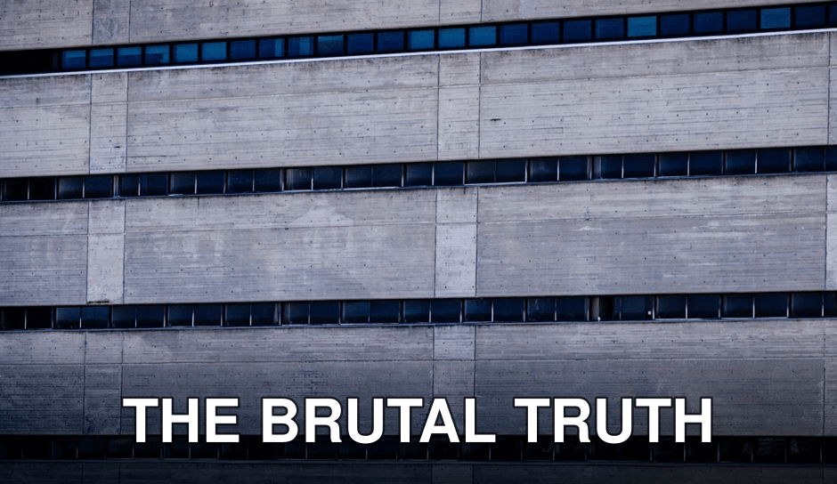 Detailed view of a concrete building facade showcasing brutalist architecture style.