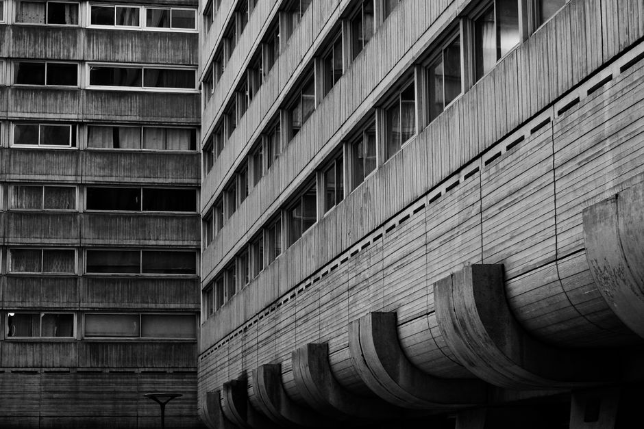 Grayscale image showcasing the raw concrete texture of Brutalist architecture.