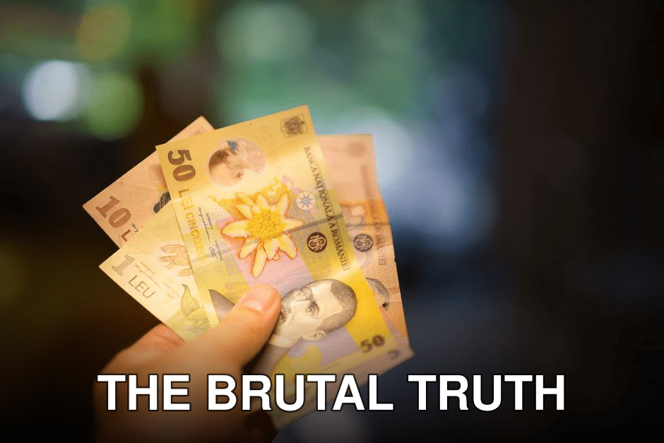 Hand holding Romanian Lei banknotes in a blurred indoor setting, highlighting currency details.