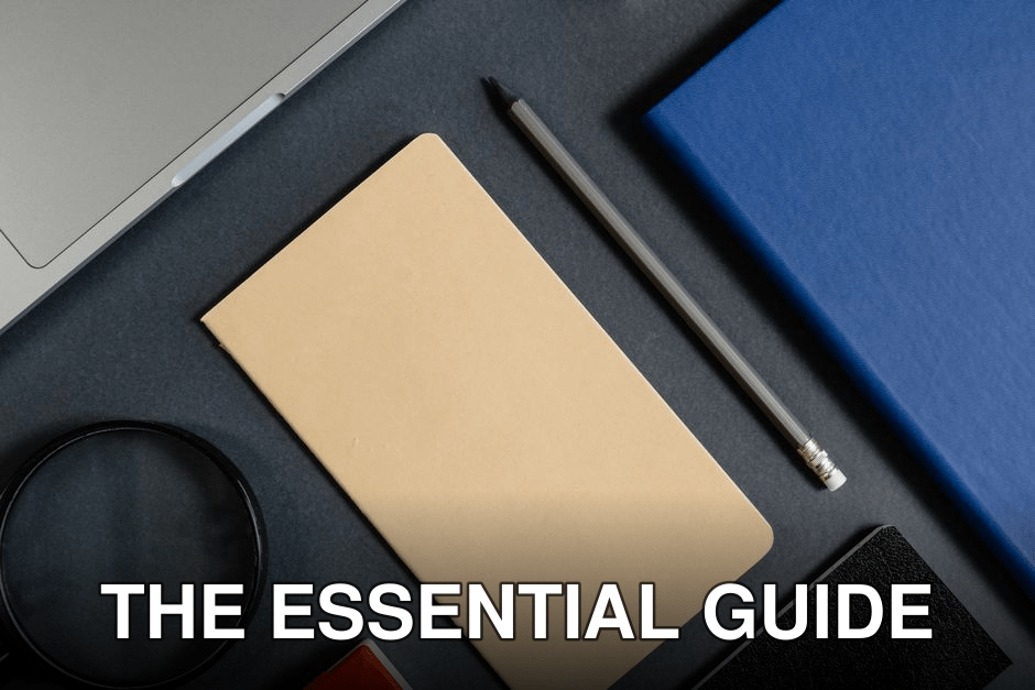 Flat lay of office stationery items with a minimalist design on a dark background.