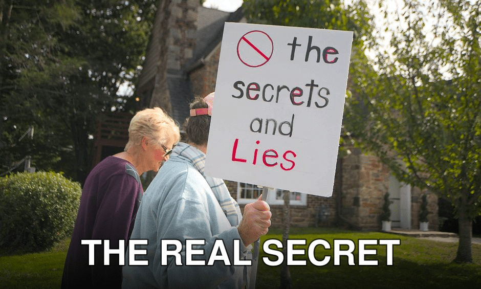 A peaceful protest in Towson with signs expressing dissent and advocacy for truth.