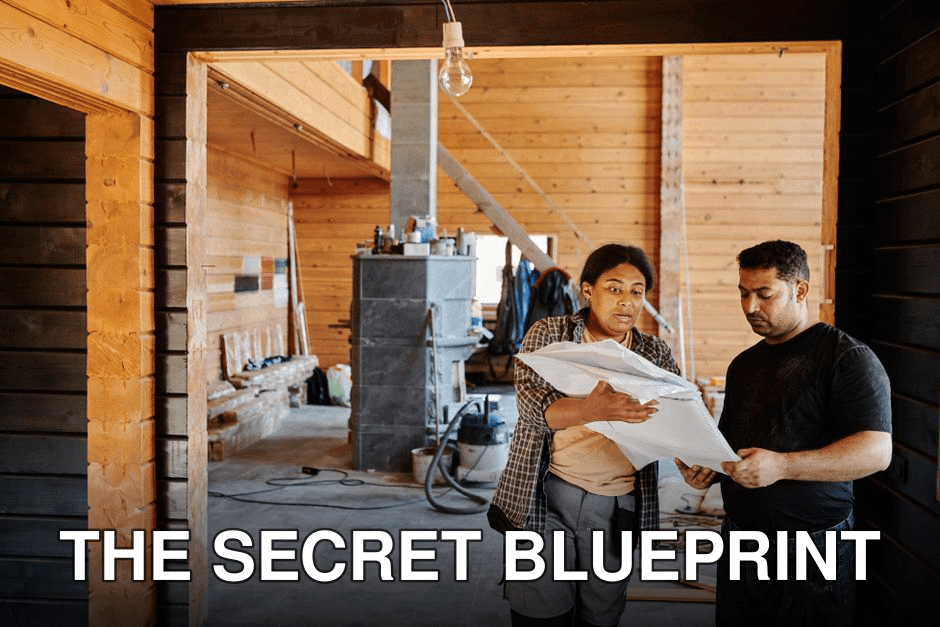 Construction workers reviewing blueprints indoors at a renovation site with wooden walls.