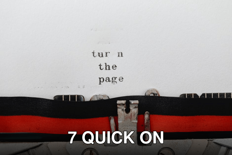 Close-up of a vintage typewriter with text 'turn the page' typed on paper, symbolizing change and new beginnings.