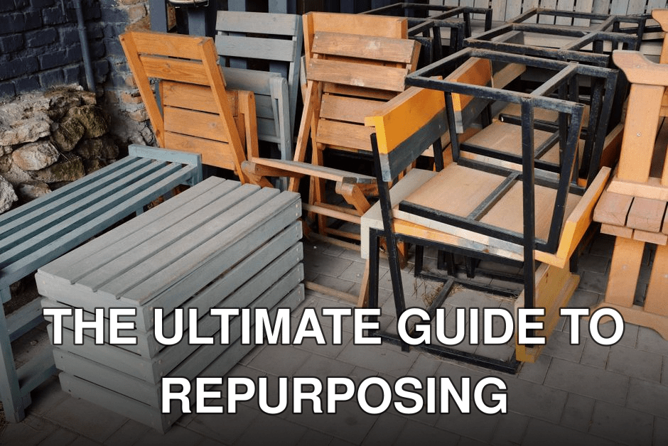 A mix of wooden benches, chairs, and metal frames stacked outside on a paved area.